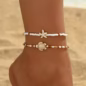 A Set of Two Women'S Anklets Featuring a Summer Ocean Theme with Starfish And Turtle Designs in Brown, White, And Beige Beads. - Image 2